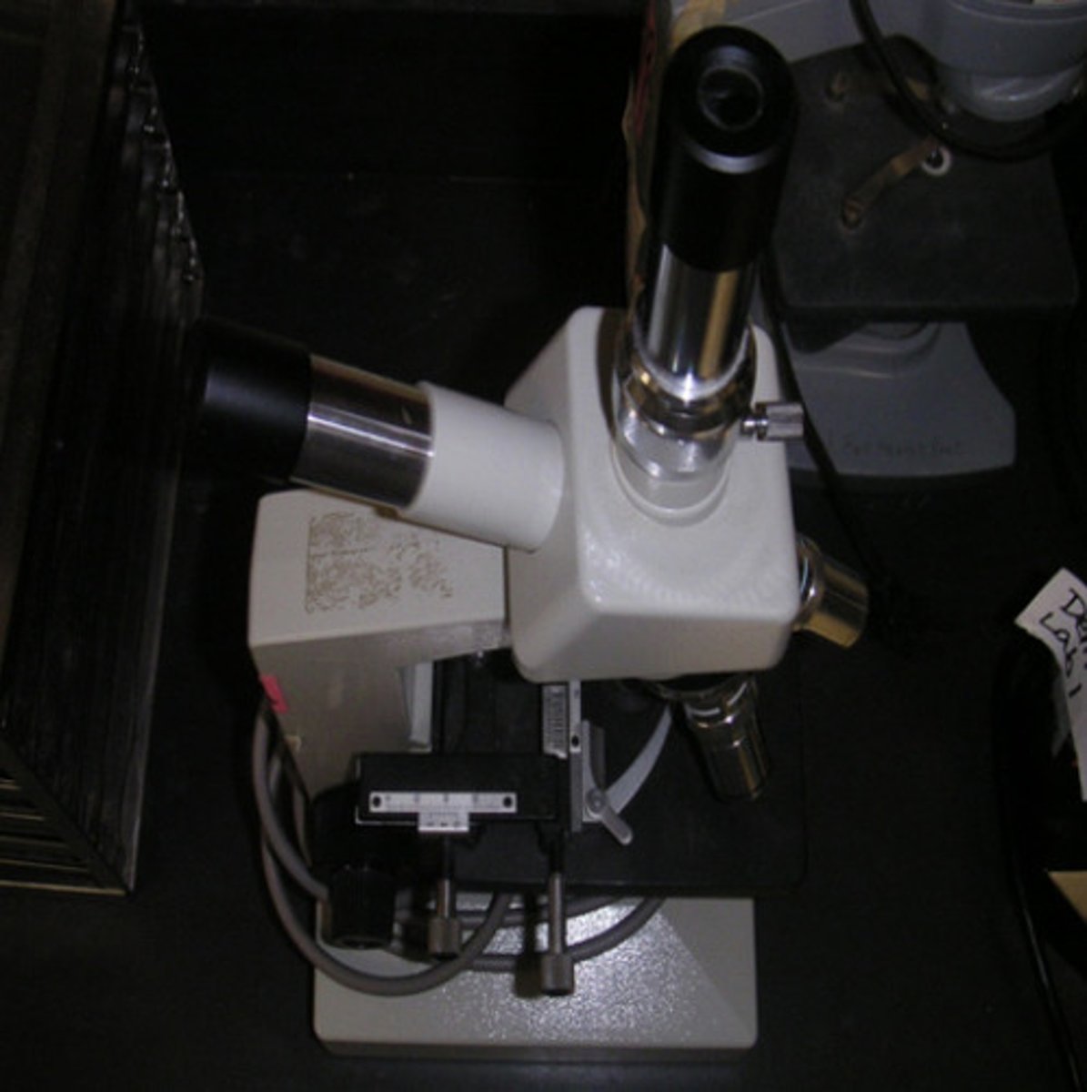 <p>A monocular microscope with a second, vertical viewing port. The vertical port can be used with an eyepiece for a second person, such as an instructor, to view the specimen, or it can be used with an adapter and a video or still camera.</p>