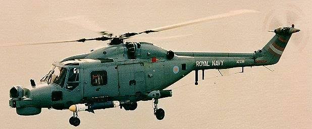 <p><span>1 wheel in front 2 behind, tail squished compared to Seahawk, 4 top blades</span></p>