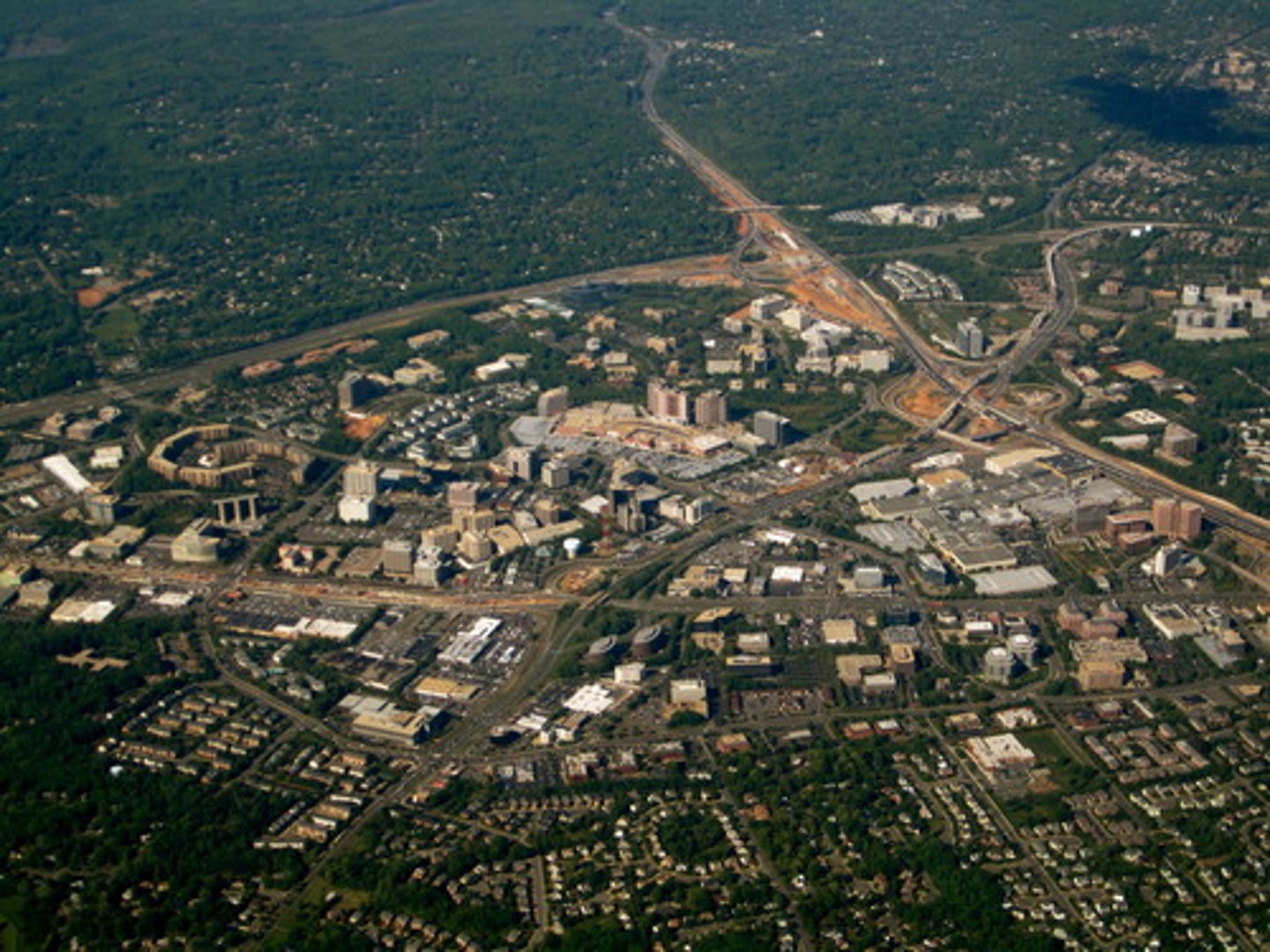 <p>A mini edge city that is connected to another city by beltways or highways</p>