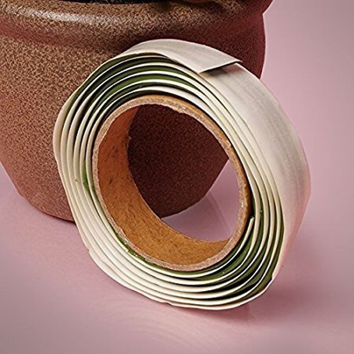 <p>is made out of a sticky clay that is used to hold down a candle or foam in a floral arrangement</p>