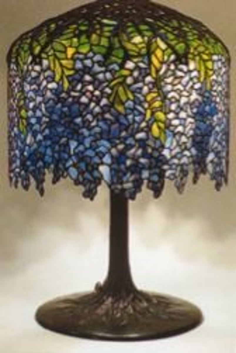 <p>Also known as Favrile glass invented by Louis Comfort Tiffany of New York. He developed an iridescent glass of great brilliance and luster with flowing shapes that influenced glassmakers in Central Europe. He was admired for his stain glass windows and iridescent Favrile blown glass bowls and other vessels. He is also known for fine silver and jewelry.</p>