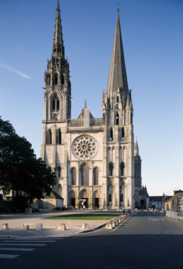 <p>very balanced, one roman tower and one more delicate, every surface decorated, high stained glass windows</p>