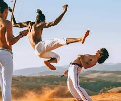<p>afro-brazilian marial art that combines dance, call&response, and music — practiced by slaves (mostly from Angola) in brazil as fighting resistance against oppression; influenced breakdancing</p>