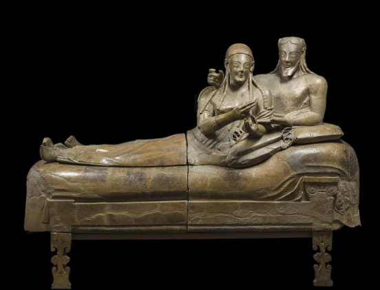 <p>Etruscan. 520 BCE. Painted terracotta. Faces and elongated bodies are characteristic of archaic period. Etruscans customarily cremated bodies. Man and woman are depicted the same size and are depicted eating together, which was different from other Mediterranean cultures. </p>