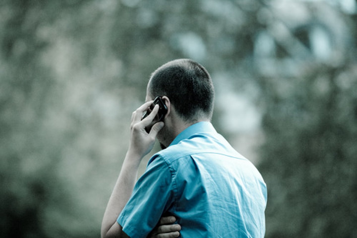 <p>The man talked on the phone.</p>