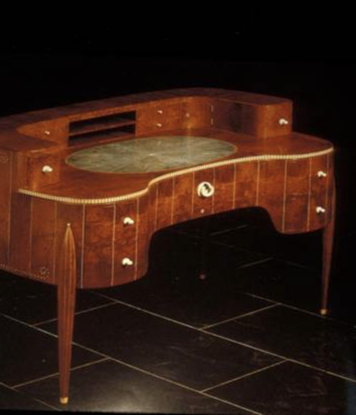 <p>uses shagreen (material that conveys plentitude) and includes inlays of ivory; decorative language, geometrical repetitive square.</p>