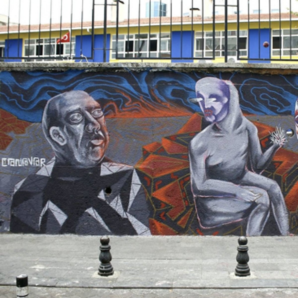 <p>a) The name means "Monster"<br>b) Although not overtly political they are grim and nightmarish. The imagery implies a level of discomfort with circumstances surrounding Turkey, mass amounts of Syrian refugees escaping the war, protests violently clashing with the police (such as Gezi park) a string of Al Qaeda attacks on Istanbul and neighboring Turkish cities contribute to the unease these murals evoke.</p>