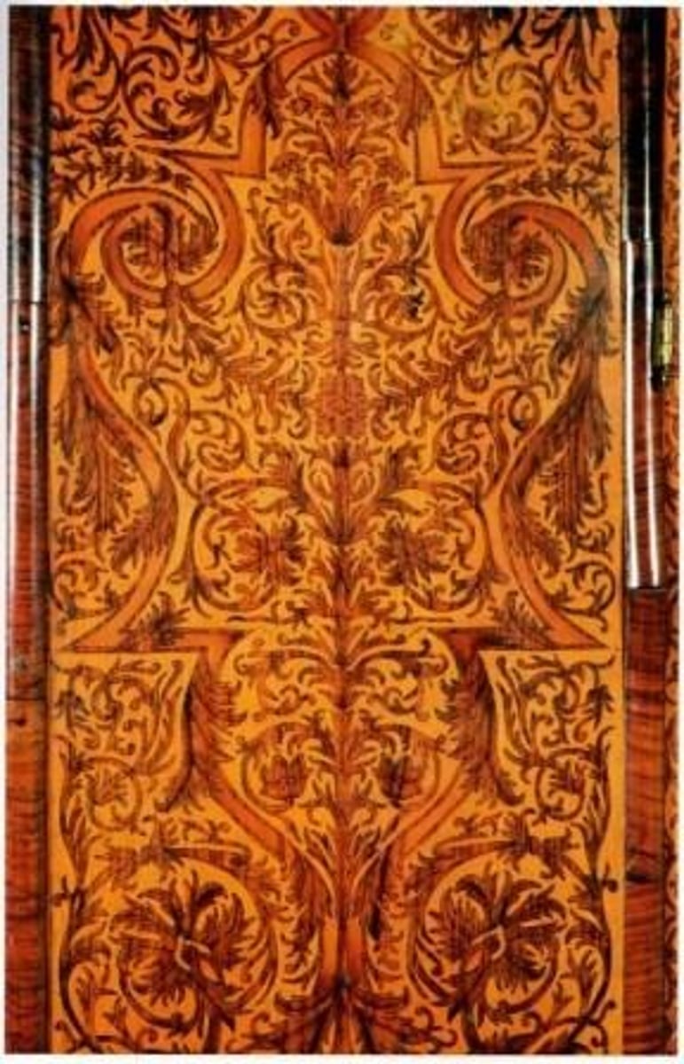 <p>A flush pattern produced by inserting contrasting materials in a veneered surface, wherein rare, grained, and colored woods are usually used.</p>