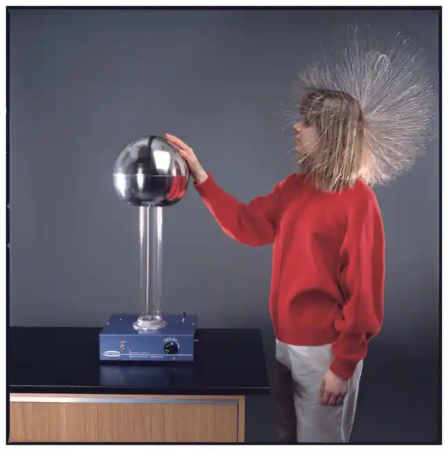 <p>It is a machine that uses friction to produce a large static charge on a metal dome</p>