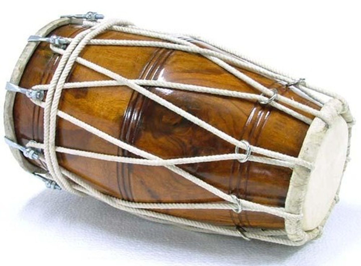 <p>two-headed drum made of mango wood, with lacings that secure the heads.</p>