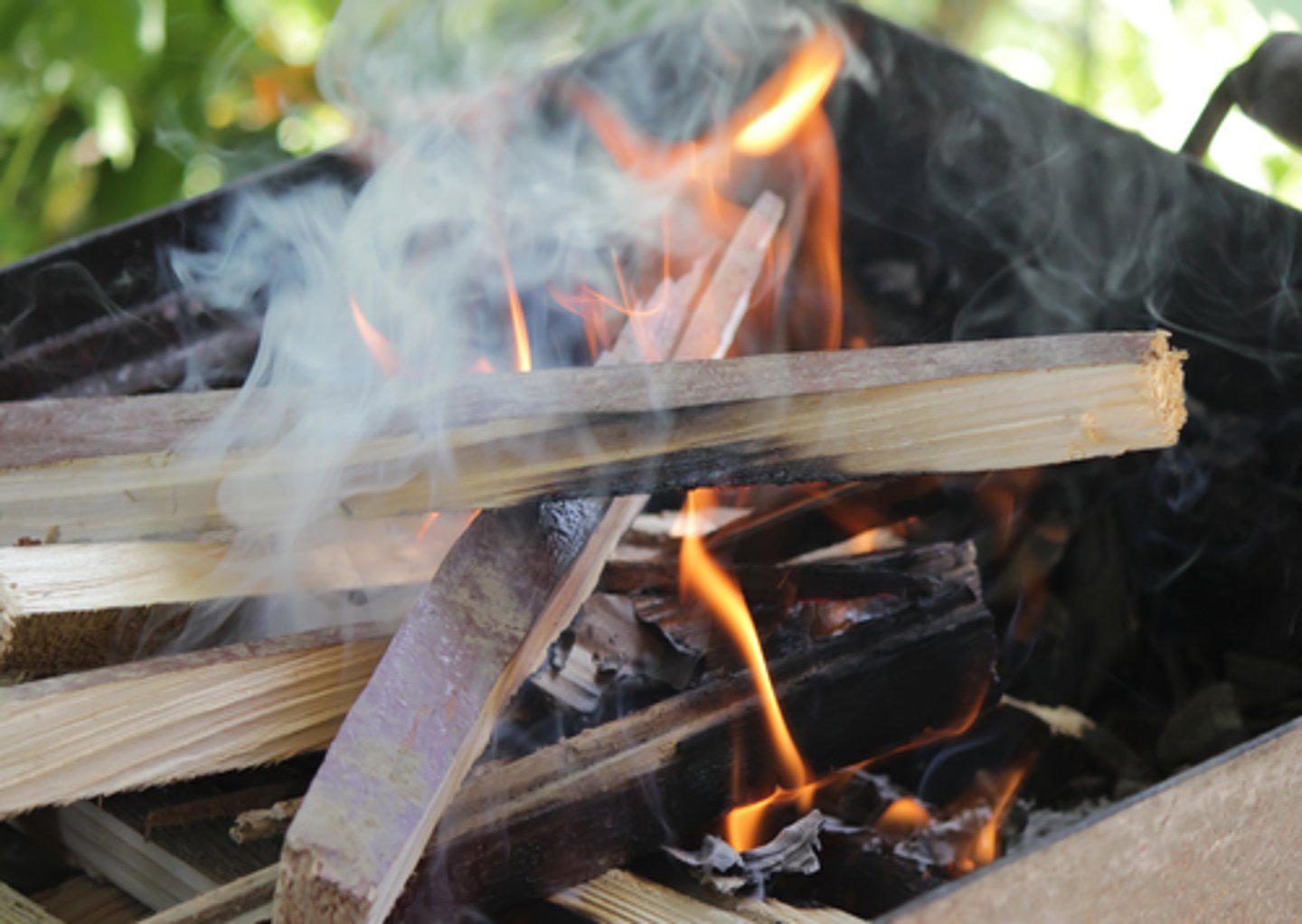 <p>to light the fire on a barbecue to begin cooking.</p><p>My uncle always offers to _________ because he knows how to do it safely and get the grill hot quickly.</p>