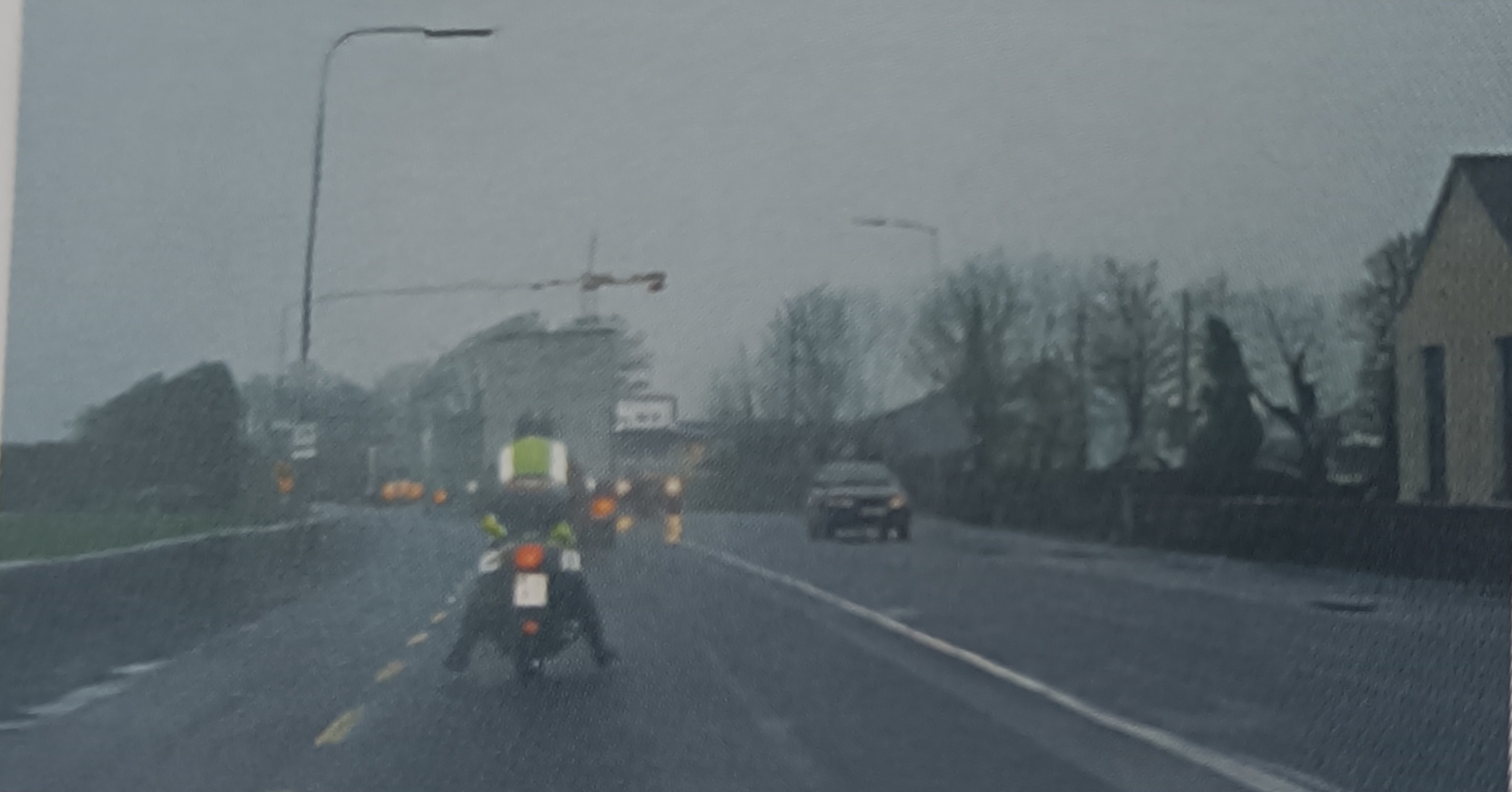 <p>In what position should a motorcyclist have their feet when driving along in traffic?</p>