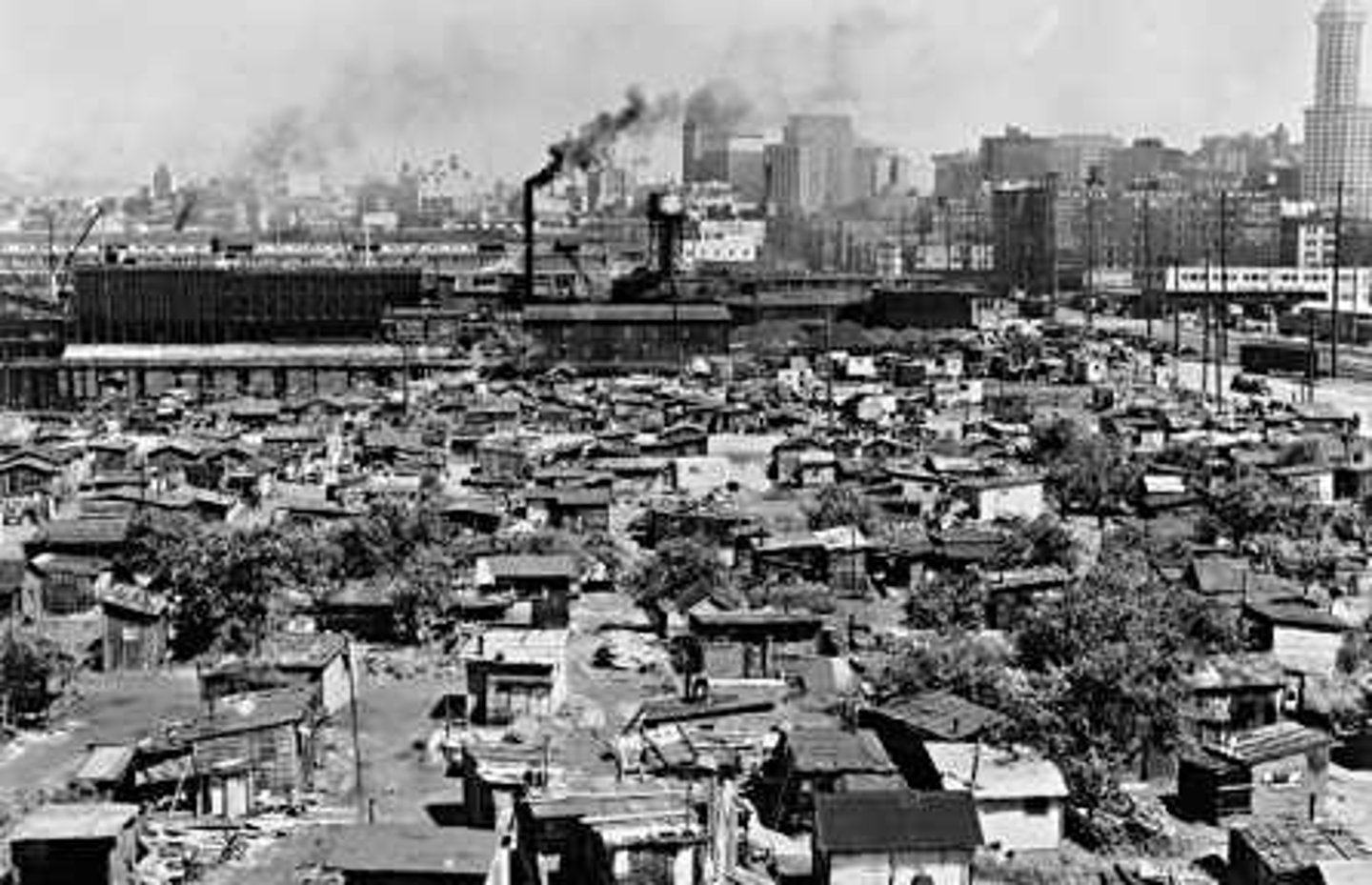 <p>shantytowns where people built shelters out of anything they could find</p>