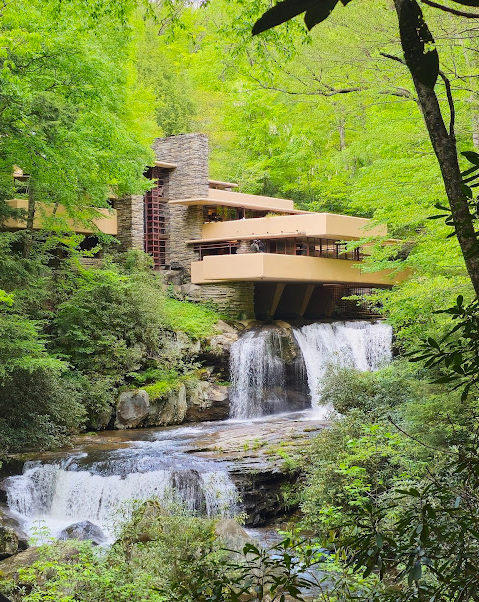 <p><span><span>Concrete cantilevers over waterfall, stone walls</span></span></p>