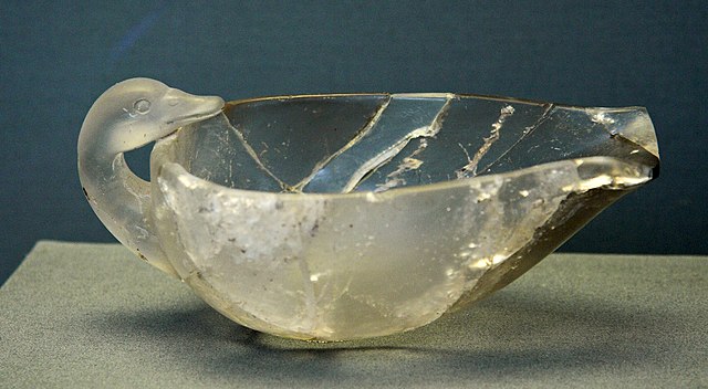 <p><strong><u>Date</u></strong> : 16th century BC</p><p></p><p><strong><u>Location</u></strong> : Grave Circle B, Mycenae</p><p></p><p><strong><u>Material</u></strong> : rock crystal</p><p></p><p><strong><u>Significance</u></strong> :</p><ul><li><p><strong>Rock crystal is imported</strong>, suggesting <strong>trade with Crete</strong></p></li><li><p><strong>impressive craftsmanship</strong> - carving duck shape out of rock crystal</p></li><li><p><strong>Decorative</strong> item</p></li><li><p>evidence of a <strong>wealthy</strong> and <strong>prosperous society</strong></p></li><li><p>Evidence of <strong>burial customs</strong> - <strong>gifts</strong> to the deceased, possibly <strong>feasting</strong>, <strong>drinking</strong> ?</p></li></ul><p></p>