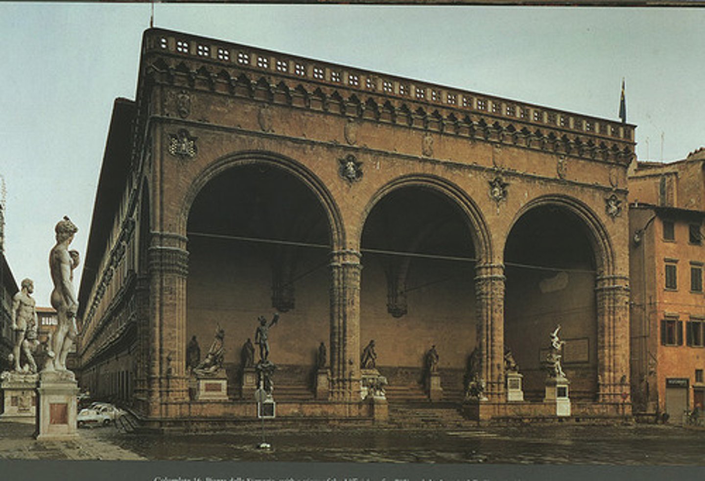 <p>a roofed arcade or gallery with open sides stretching along the front or side of a building</p>