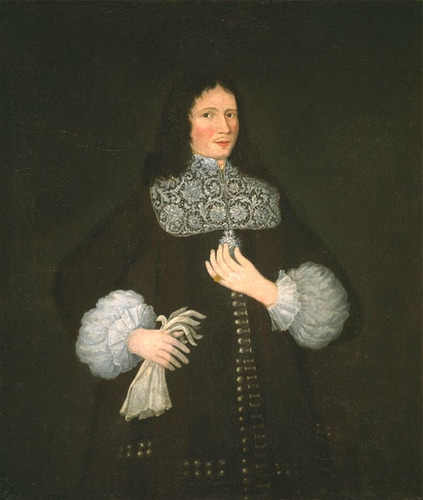 intricate lace collar, elaborate cuffs, and gloves