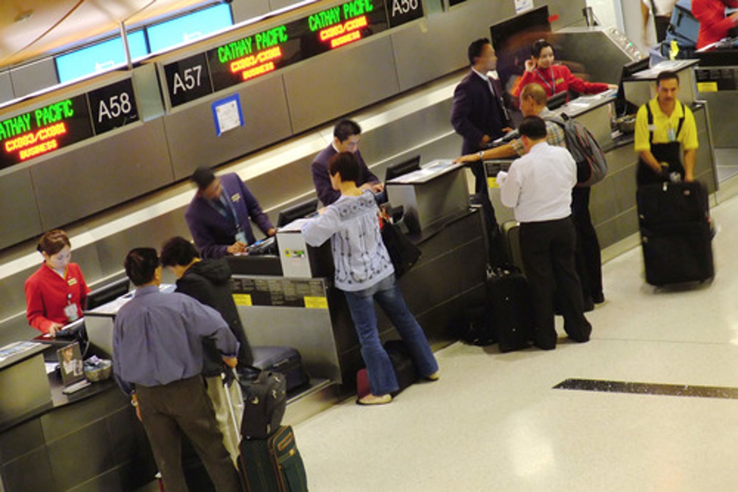 <p>(for a flight) To report your arrival at the airport and hand over your luggage before flying.</p>