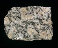 <p>igneous, dominant minerals are orthoclase, quartz, plagioclase, biotite, and hornblende. coarse-grained texture, light colored, visible crystals.</p>