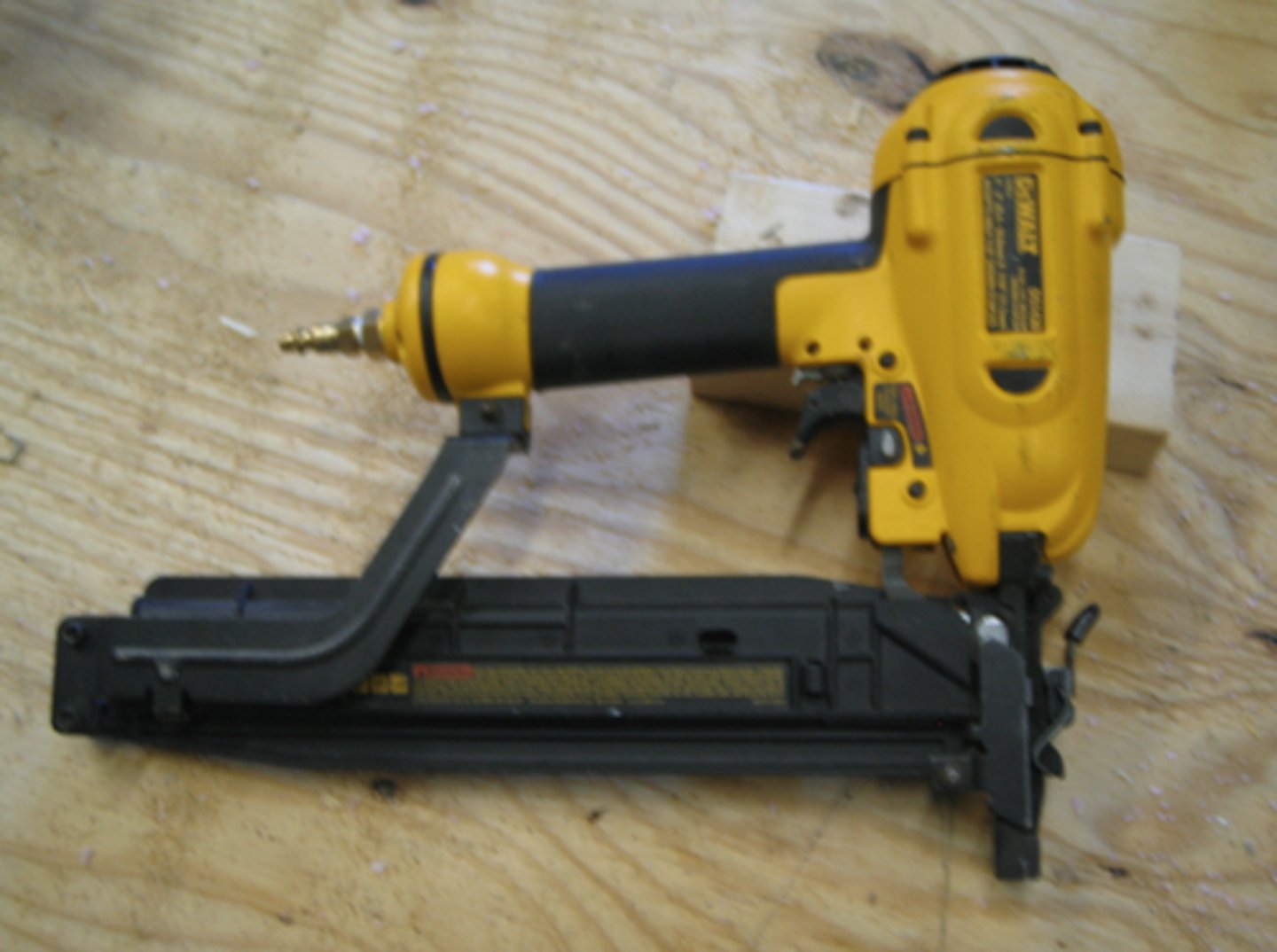 <p>Handheld power tool:<br>- Uses air pressure to force nails into wood.<br>- Good for repetition</p>