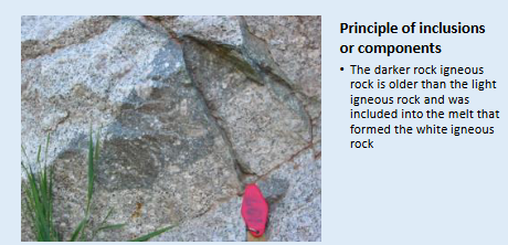 <p><span>The darker rock igneous rock is older than the light igneous rock and was included into the melt that formed the white igneous rock</span></p>