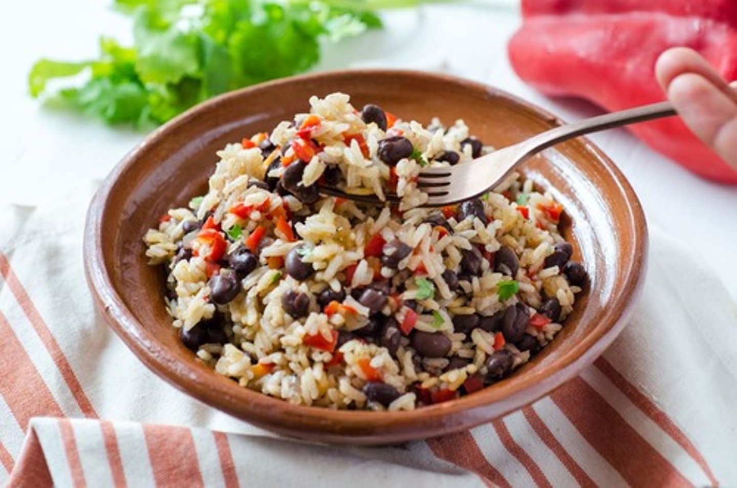 <p>Rice and beans mixed with spices, served as a staple dish.</p>