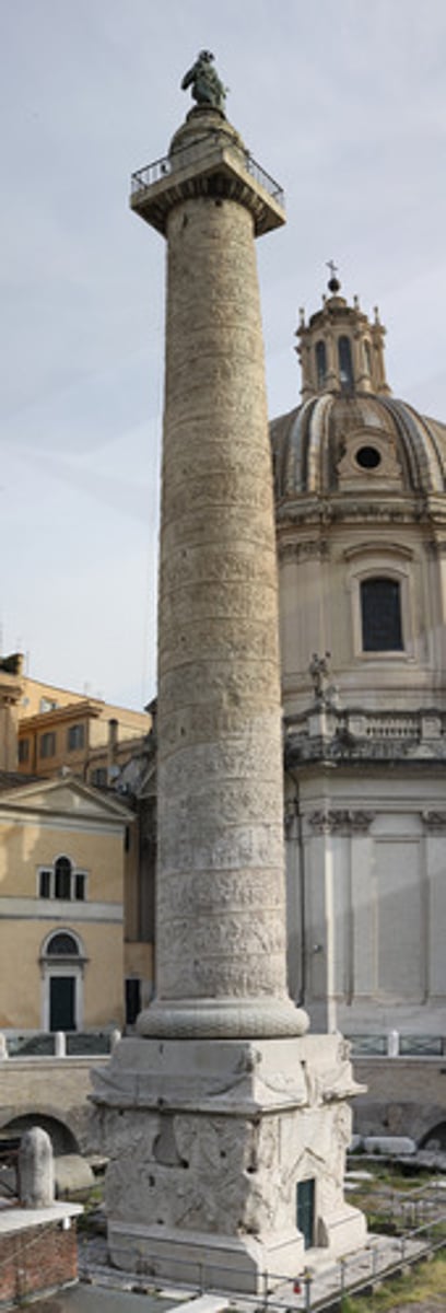 <p>a monument in the form of a column, erected in memory of a victorious battle, war, or revolution ; the column typically stands on a base and is crowned with a victory symbol, such as a statue</p>