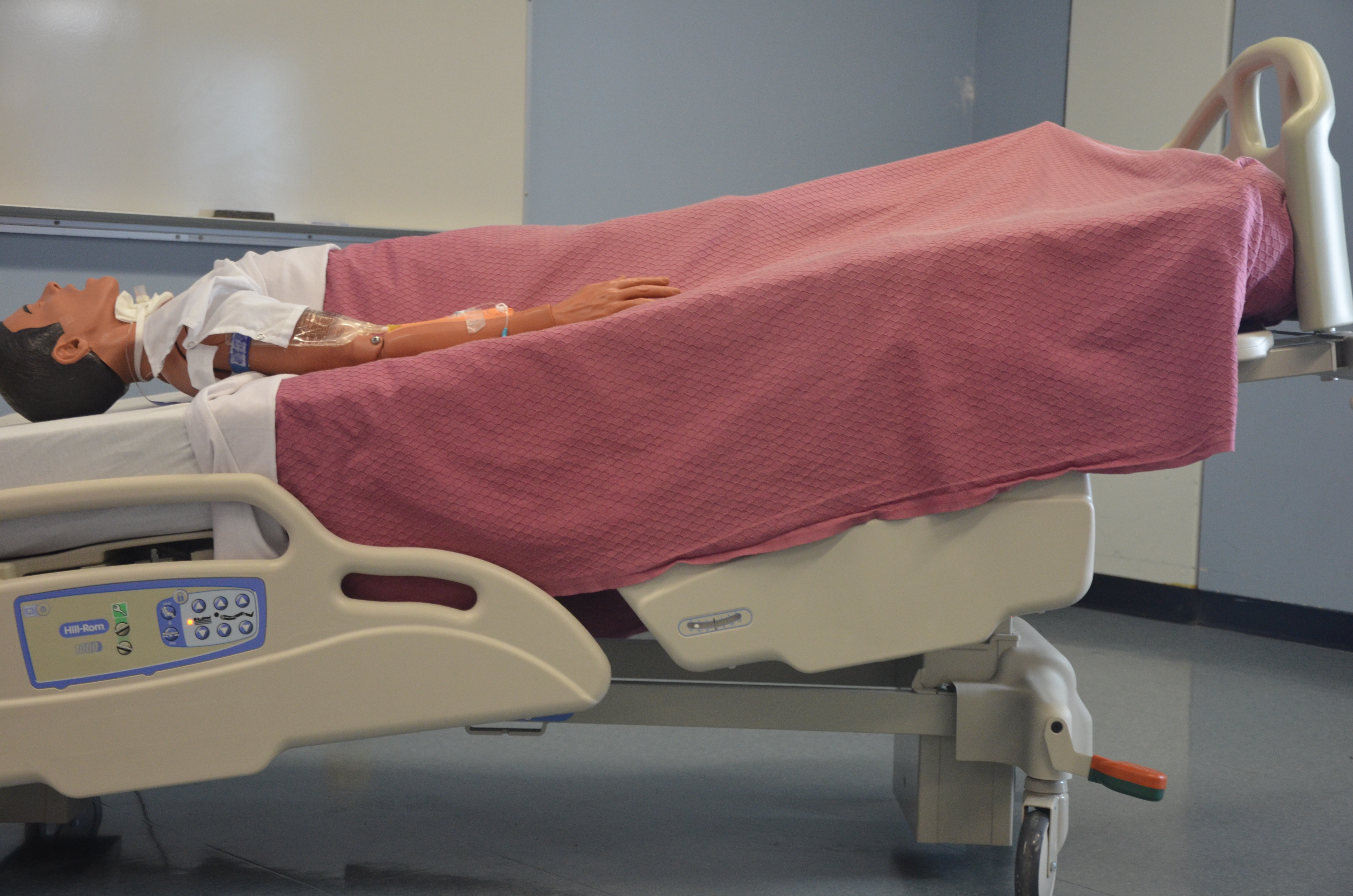 body is laid supine with feet elevated on a 15-30 degree incline above the head