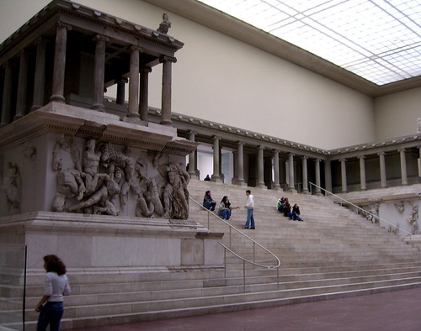 <p>Form:</p><p>-marble frieze</p><p>-elevated with steep dramatic staircase</p><p>-complex forms with big muscles showing violent energy and detail</p><p>-ionic columns</p><p>Content:</p><p>-frieze wrapping around the monument shows gods overpowering the Titans</p><p>-Titans vs. Olympians</p><p>-"Athena": gigantomachy, battle between the gods and giants (gods win)</p><p>Function:</p><p>-war monument (Greek defeat of Gauls)</p><p>-break architectural boundaries</p><p>-altar dedicated to ZeusContext:</p><p>-175 BCE</p><p>- Asia Minor, Turkey</p>