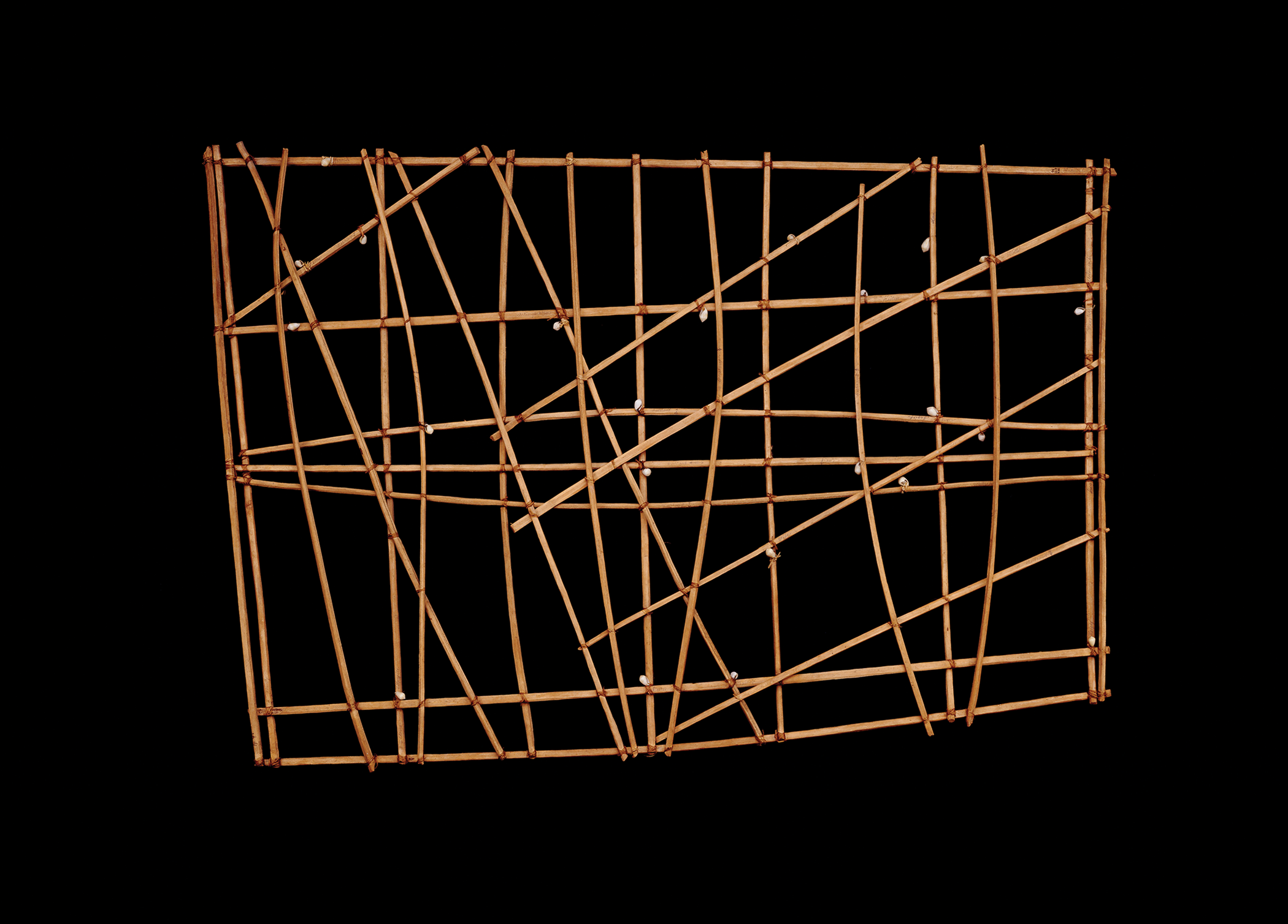 <p>In the work shown, which of the following fabrication methods contributes to the content and resulting function of the piece?</p><p><strong>A </strong>Interlacing horizontal and vertical sticks at regular intervals to create a strong fishing basket</p><p><strong>B </strong>Mapping the location of inland drinking water sources through the careful placement of small cowrie shells</p><p><strong>C </strong>Lashing together sticks with flexible fiber to allow for repositioning of lines in a decorative grid</p><p><strong>D </strong>Placing curved sticks to represent ocean wave swells on a navigational training chart</p>