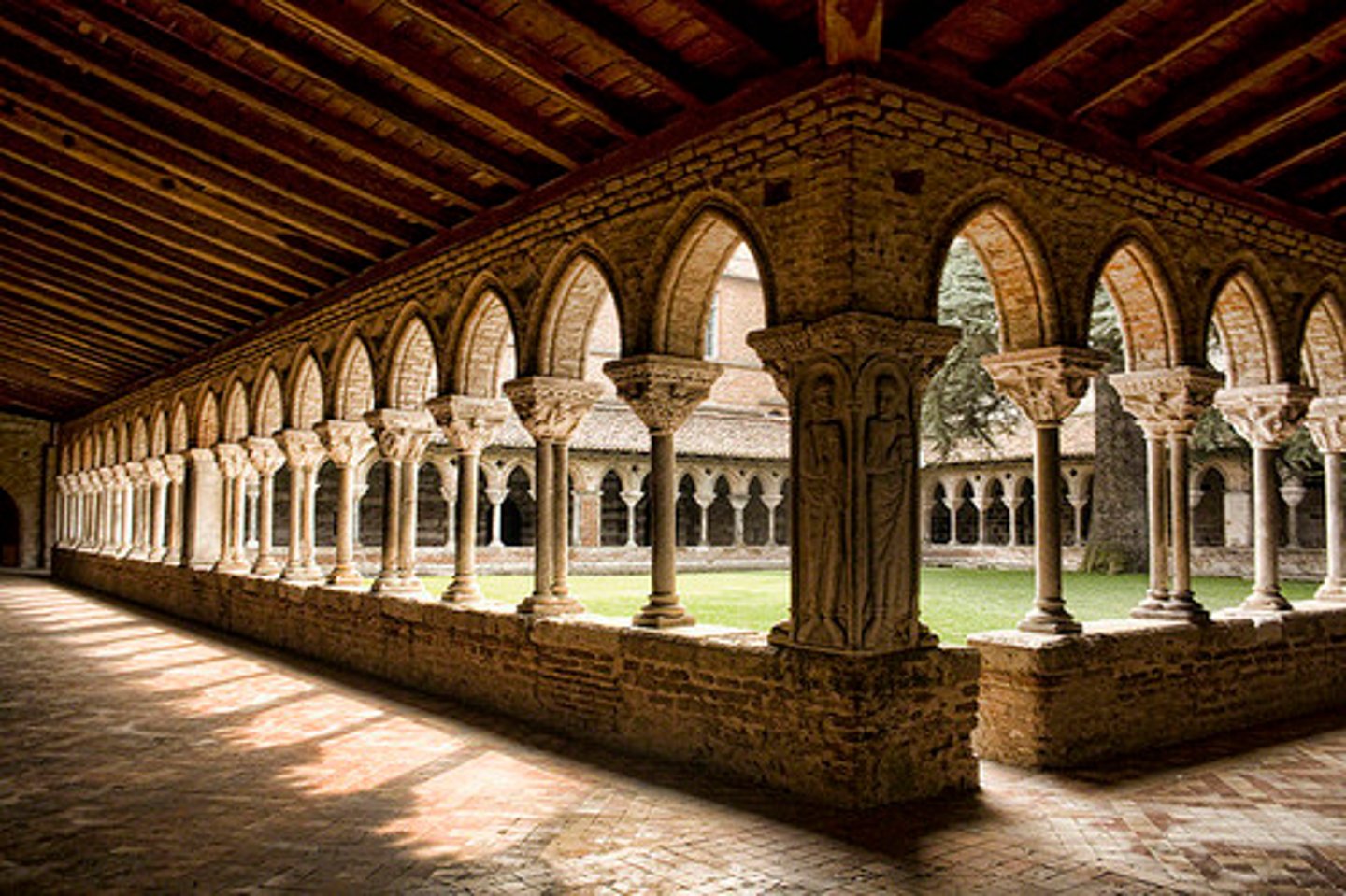 <p>A covered walkway surrounding an open courtyard, typically attached to a monastery and used for meditation and communal movement.</p>