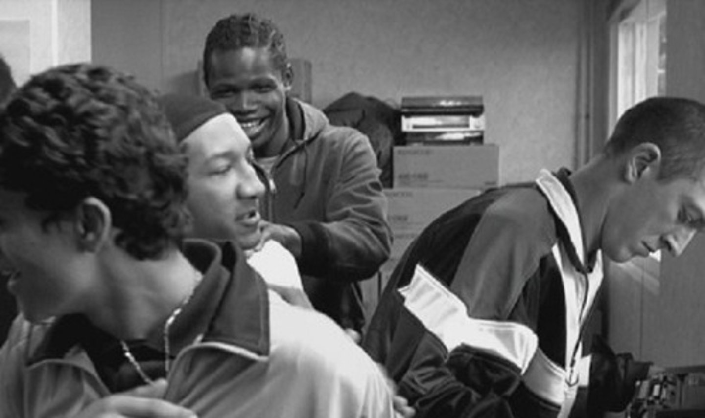 <p>Friend of the trio <br>Owes money to Said<br>His car (all he ever owned) was burnt down during the riots</p>