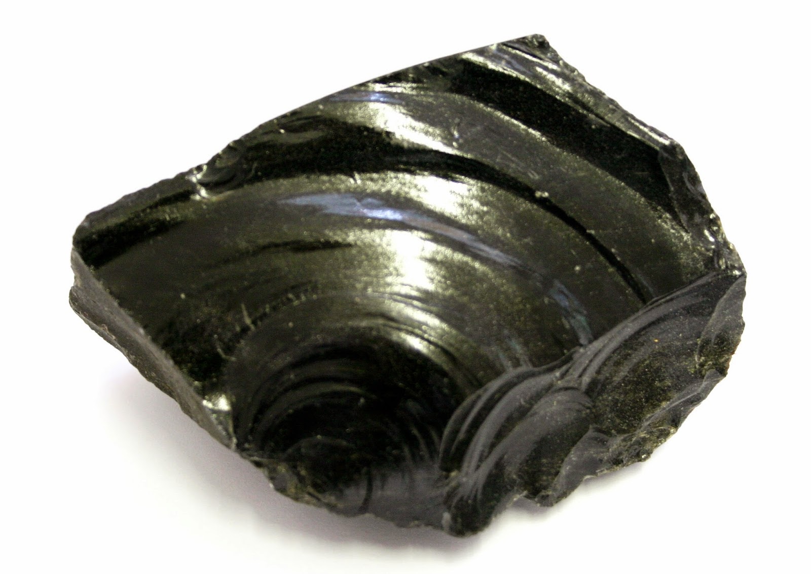 <p>Igneous rock: Obsidian</p><p>Obsidian is a glassy, extrusive igneous rock with a felsic composition, and is typically black in color but may also be rust-red or display whiteish ‘snowflake’ inclusions. It often displays conchoidal fracturing with very sharp edges. Obsidian is made from the rapid cooling of silica-rich lava<span style="font-family: system, BlinkMacSystemFont, -apple-system, .SFNSText-Regular, San Francisco, Roboto, Segoe UI, Helvetica Neue, Lucida Grande, sans-serif">.</span></p>