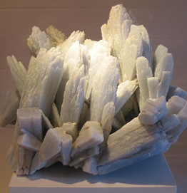 <ul><li><p>CaSO<sub>4</sub> - anhydrous (no water)</p></li><li><p>occurs in</p><ul><li><p>evaporites with gypsum</p></li><li><p>diapirs, igneous rocks, metamorphosed evaporite rocks</p></li></ul></li></ul><p></p>