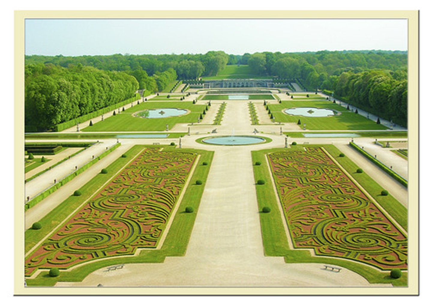 <p>an ornamental arrangement of flower beds of different shapes and sizes</p>