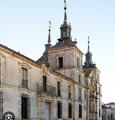 <p>Designed by <strong><em>JOSE BENITO DE CHURRIGUERA </em></strong><em>in 1709</em></p><p><em>Part of an industrial and residential complex for </em><strong>Juan de Goyeneche</strong> – a prominent Spanish entrepreneur.</p><p>The palace showcases a sober rectangular façade with balustrades and rusticated stonework, contrasting with the more elaborate Churrigueresque façade of the church, featuring twisted columns and intricate sculptural details around the entrance.</p>