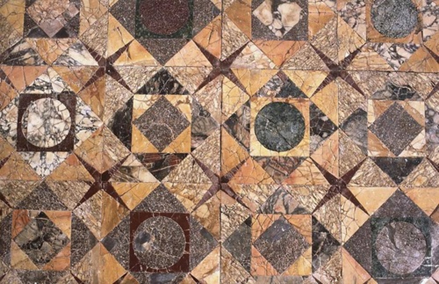 <p>any mosaic of regularly cut material</p>
