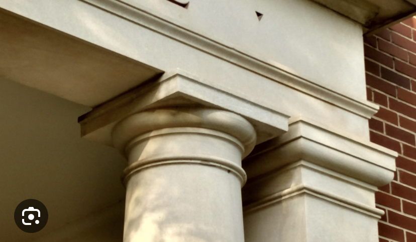Unfluted columns on a pedestals 