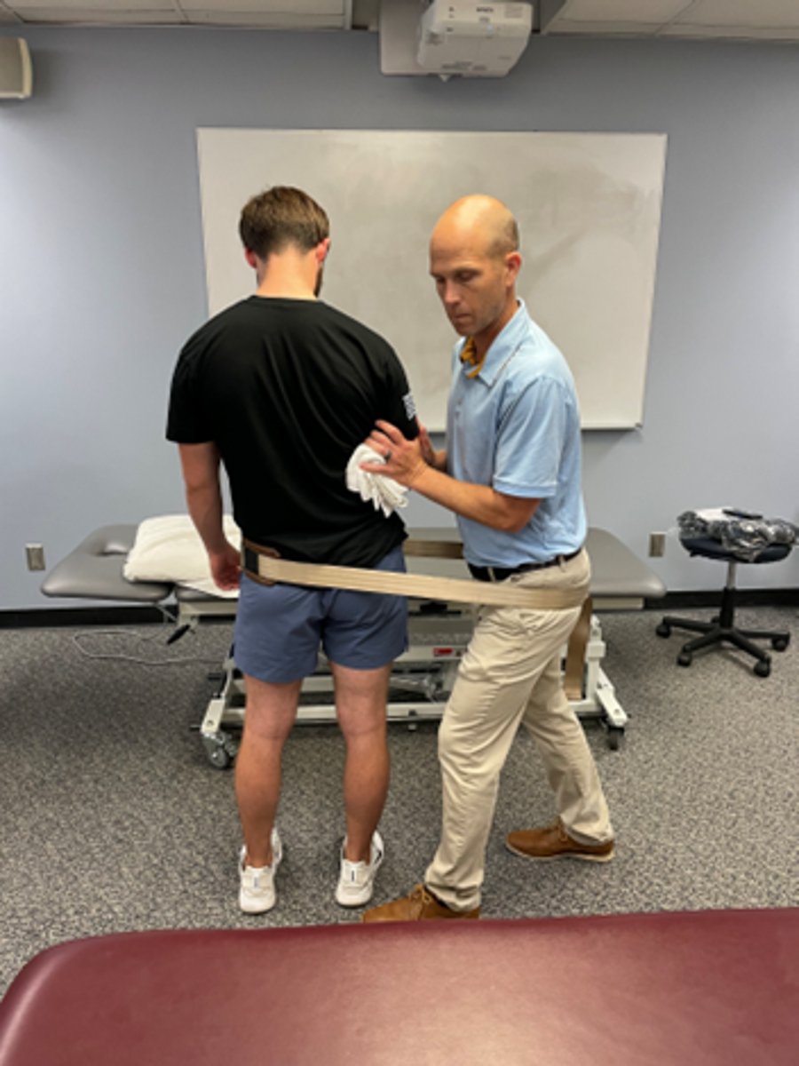 <p>extension bias</p><p>wide BOS</p><p>stabilize pt’s trunk with therapist’s hands, using pt’s bent arm held into rib cage</p><p>wrap belt around hips</p><p>should be side glide, not flex</p>