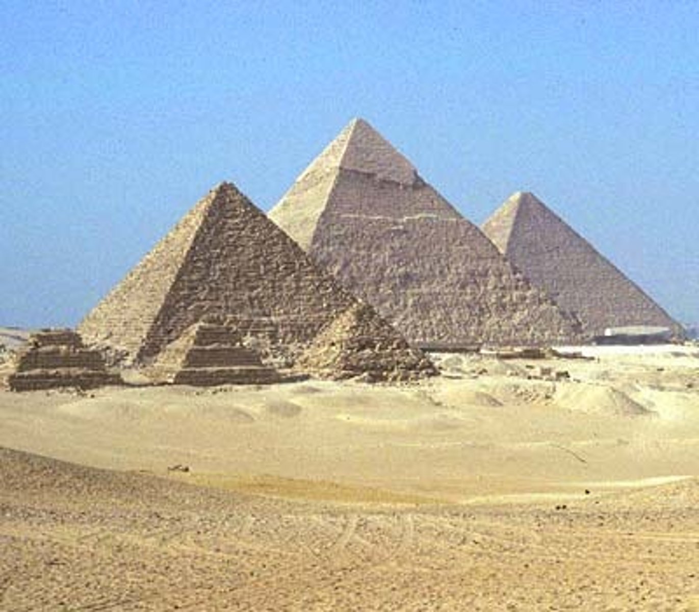 <p>- Three large pyramids built for pharaohs Khufu, Khafre, and Menkaure (c. 2560-2510 BCE)</p><p>- The Great Pyramid of Khufu is one of the Seven Wonders of the Ancient World</p><p>- Built with millions of limestone and granite blocks, some weighing up to 80 tons</p><p>- Complex includes causeways, valley temples, and subsidiary pyramids for queens</p><p>- Built by organized, well-fed workers — not slaves, per Heit-el-Ghurab excavations</p>
