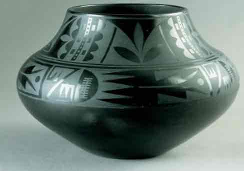 <p>black on black ceramic vessel</p>