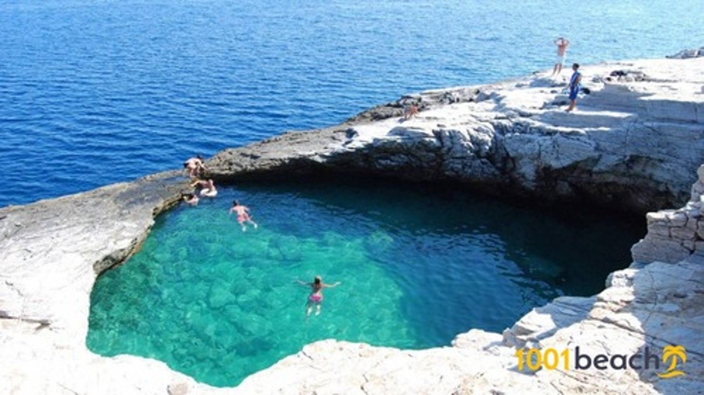 <p>Area of relatively shallow, quiet water situated in a coastal environment and having access to the sea but separated from the open marine conditions by a barrier. The barrier may be either a sandbar, a barrier island or it may be a coral reef.</p>