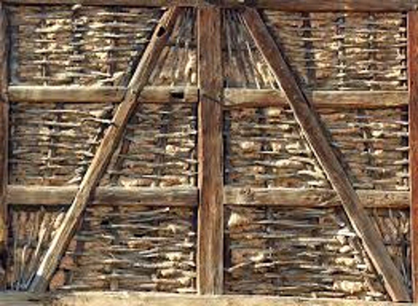 <p>Having a timber framework with the spaces filled with masonry or plaster</p><p>Common in 16th Century England. Associated with the Tudor Style</p>
