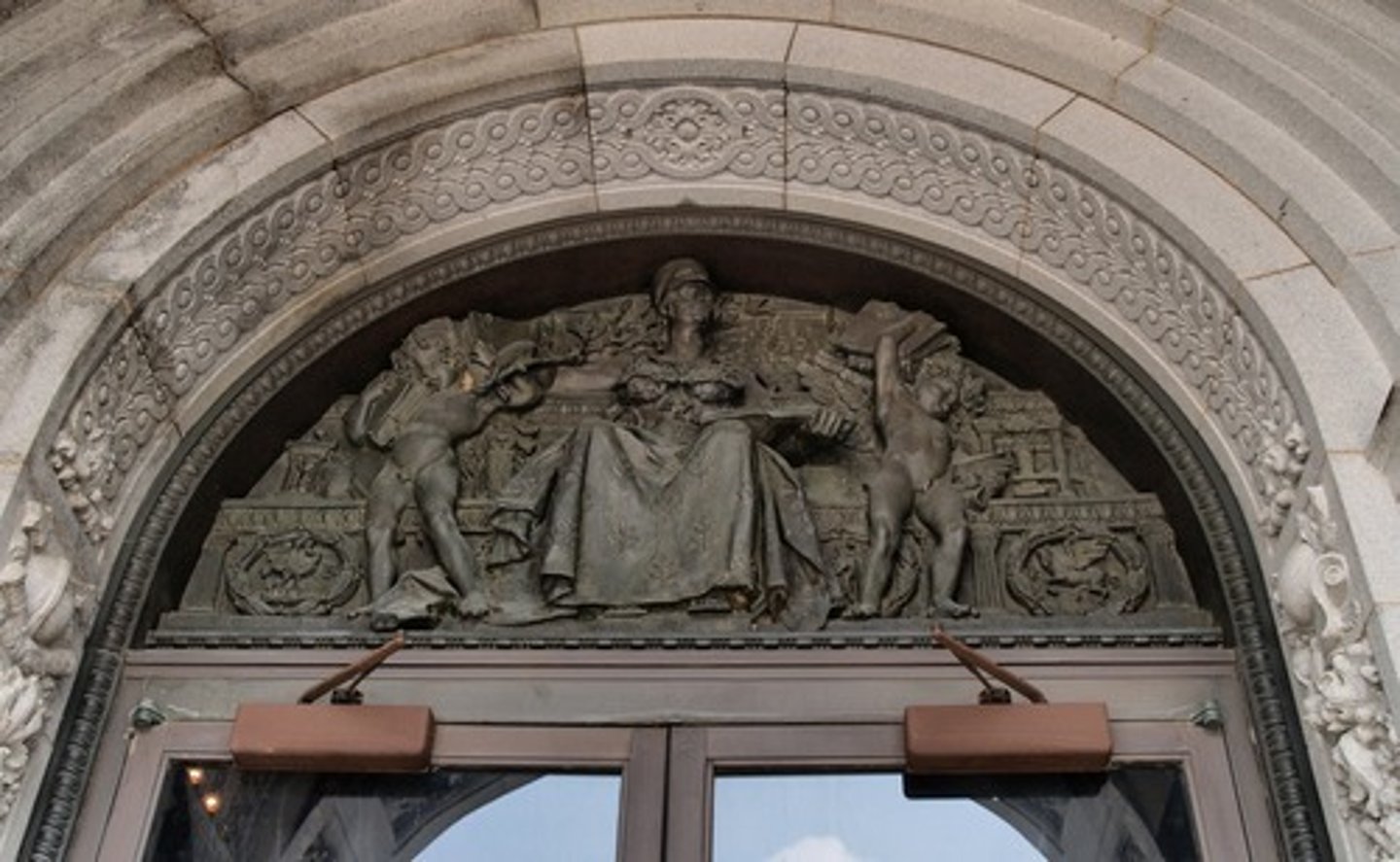 <p>a crescent-shaped space, sometimes over a doorway, that contains sculpture or painting</p>