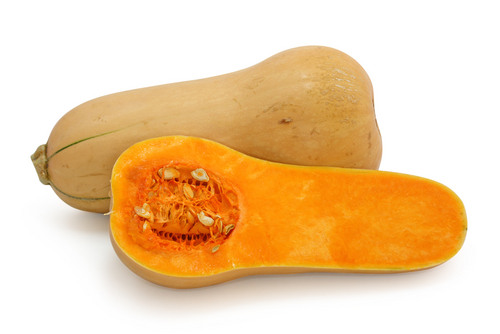 an orange - yellow outside and an oblong / hourglass shape, with a thicker bottom to a thinner middle to a thicker top. The bottom encases seeds and a orange - yellow flesh.