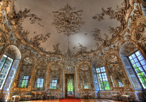 A style of decorative art that evolved from the Baroque, originating in France about 1720 and distinguished by fanciful, curved spatial forms and elaborate, profuse designs of shellwork and foliage intended for a delicate overall effect.