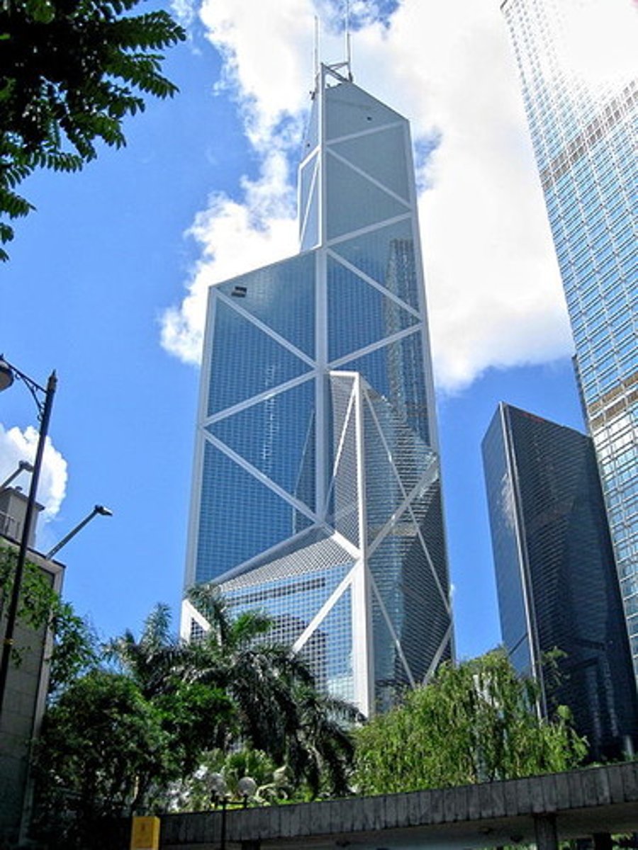 <p>The skyscraper was for a few years the tallest building in the world outside the United States. Designed by the American architect I.M. Pei, the tower has a distinctive three-dimensional triangular shape (quadrilateral at the bottom and trilateral at the top), which, according to Pei, transfers "all vertical stress to the four corners of the building, making it very stable and wind resistant".</p>