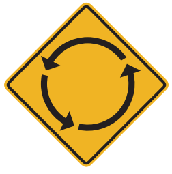 Provides advance notice of a roundabout. Prepare to slow down and possibly yield to traffic in the roundabout.