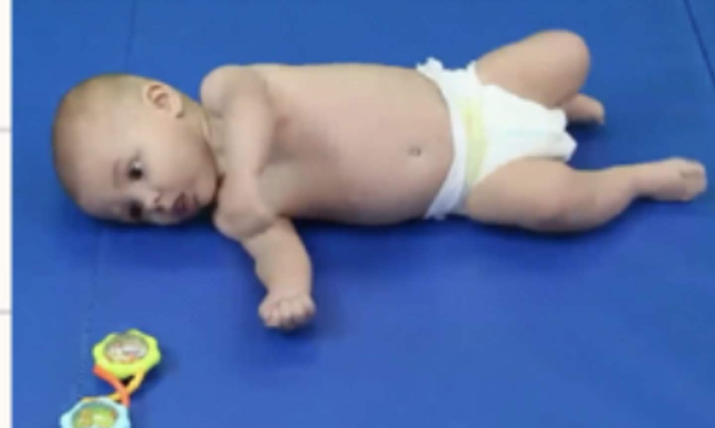 <p>Rolling supine to side lying is seen - flexed posture - initiated be head rotation or by an asymmetrical position of LE which causes a lateral weight shift</p>