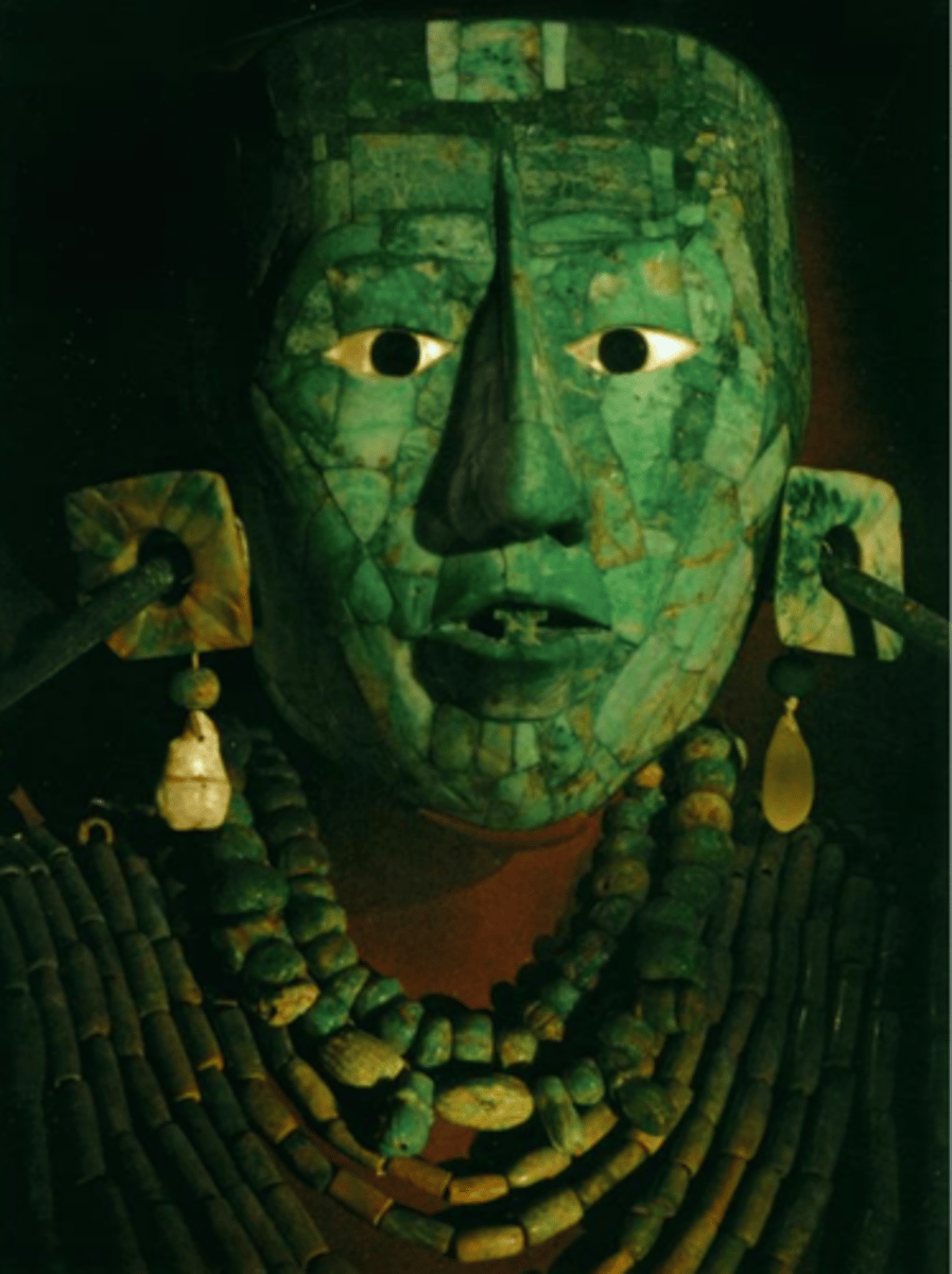 <p>683 CE; Maya</p><p>death mask ideals: filed teeth=glyph for wind , crossed eyes for sun god, nose piece= maize god. made of jade</p>